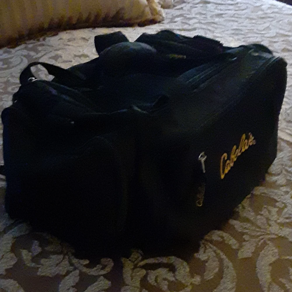 Cabela's black duffel bag gold embroidered logo 12